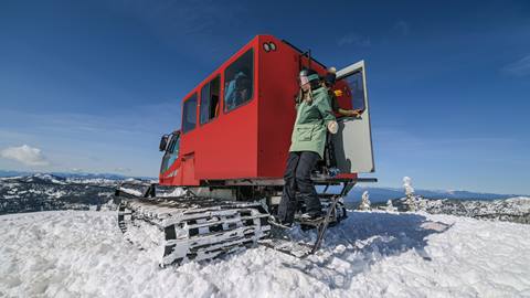 guided cat skiing guest steps out at schweitzer